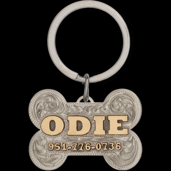 The Odie Custom Dog Tag! Crafted from a durable hand engraved German Silver base, featuring jeweler's bronze letters and a unique bone shape. Order now!"